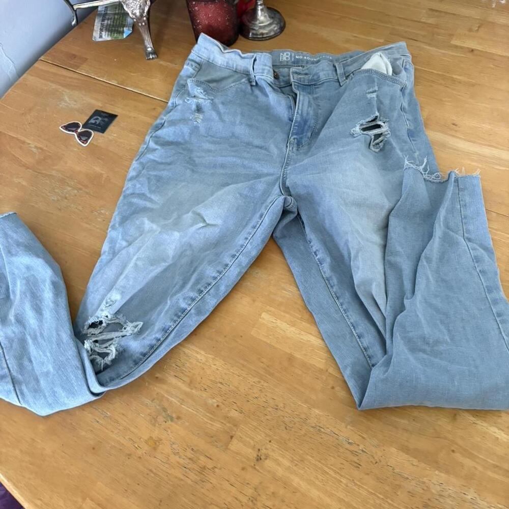 Light wash distressed denim jeans